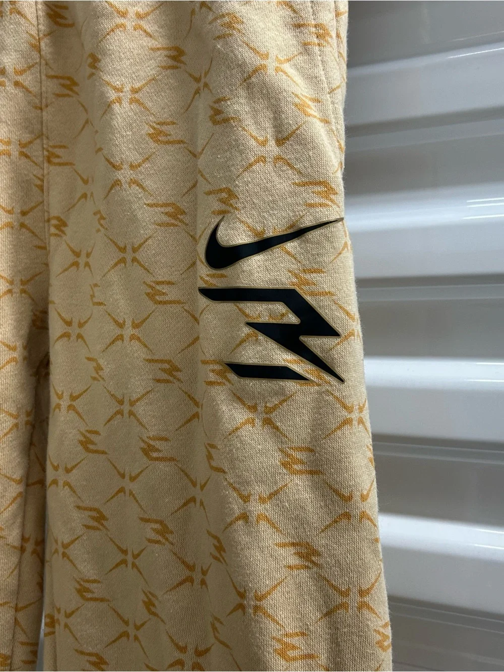 Nike Youth Light Yellow Patterned Joggers with Black Swoosh